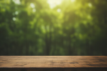 Naklejka na ściany i meble a dark wooden table top with a blurred green tropical forest background and warm light flare.