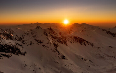 Sunset over the rocky peaks in the High Tatras