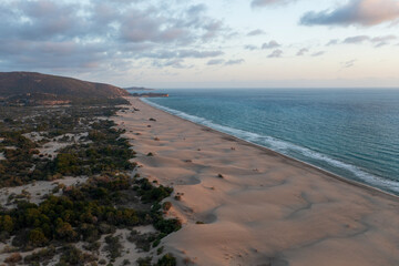 Beach and waves from top view. Turquoise water background from top view. Summer seascape with dunes from air. Top view from drone. Travel concept and idea
