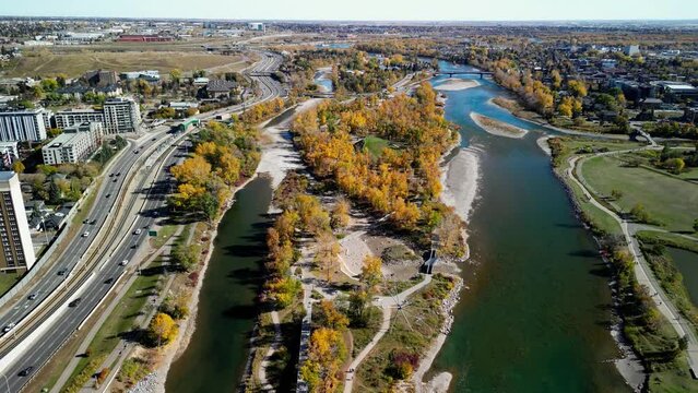 St. Patrick's Island Park and Bow River and Memorial Drive aerial view in autumn season. Fall foliage in City of Calgary, Alberta, Canada. George C. King Bridge.