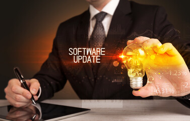 Businessman holding a lightbulb concept