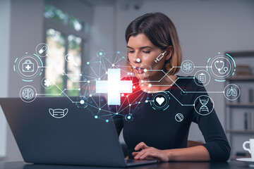 Pensive attractive beautiful businesswoman in formal wear working on laptop at office workplace in background. flying medical icons. Concept of health care and insurance.