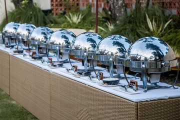 Stainless steel chafing dish at buffet line ready for catering wedding, business corporate,...