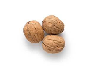 Three walnuts top view on white background