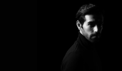 Leader handsome young cool business man portrait Attractive bearded confident guy with black and white photo look at camera Smart man stand in dark room Confident Cool man looking at camera copy space - obrazy, fototapety, plakaty