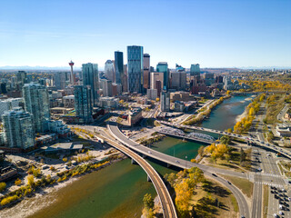Fototapeta na wymiar Downtown Calgary skyline and Bow River in autumn season. Aerial view of City of Calgary, Alberta, Canada.