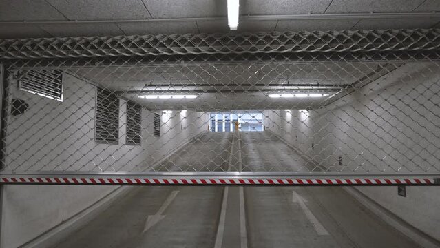 opening a Roller grilles door to leave an underground carpark