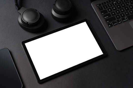 Template of tablet computer with empty white mockup screen on the table. Flat lay template for advertisement of business products or applications.
