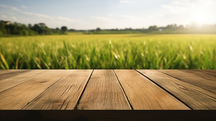 Wooden table. Rice field blurred background.