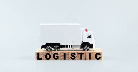 White toy truck on blocks with the text LOGISTIC.