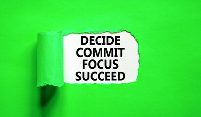 Decide commit focus succeed symbol. Concept word Decide Commit Focus Succeed on beautiful white paper. Beautiful green paper background. Business decide commit focus succeed concept. Copy space.