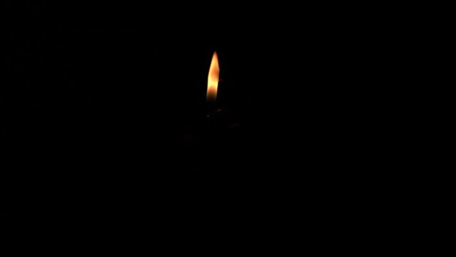 set off fireworks: hand lighting fuse with lighter, UHD 600fps horizontal video