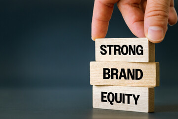 A symbol of the values of a strong brand. Business concept, words Strong Brand Equity on wooden...