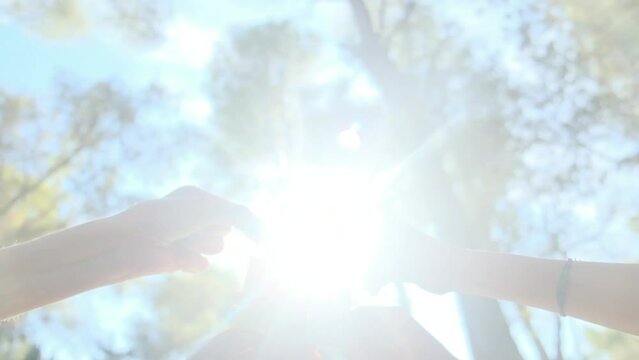 Hands of individuals across various age groups coming together to piece a puzzle, embodying the essence of teamwork, cooperation, and effective problem-solving. Witness the power of collaboration.