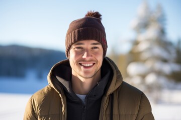 Portrait of a joyful man in his 20s donning a warm wool beanie against a backdrop of a frozen winter lake. AI Generation
