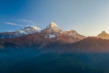 Machapuchhare or Machapuchare mountain peak in the Annapurna range, seen from Poon Hill trek trail in Pokhara, Himalayas, Nepal