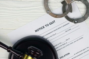 Notice to quit or eviction notice blank document paper ready to fill with handcuffs and judge...