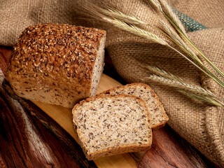 Wheat and rye sourdough mold bread with sesame seeds and flaxseed. Traditional homemade bread from...