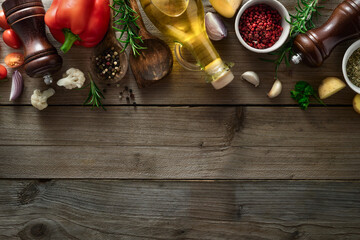 Menu background. Spices and ingredients for cooking food on a wooden table with copy space top view
