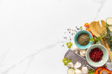 Spices and ingredients for cooking food on white background with copy space top view. Menu background