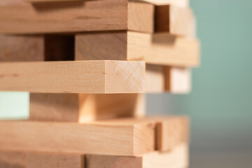 Close up take one block on The tower from wooden blocks.