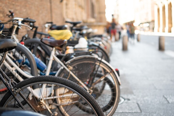 Set of Bicycles parked on street in row with blur road background
