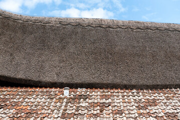 Roof partially thatched and partially tiled