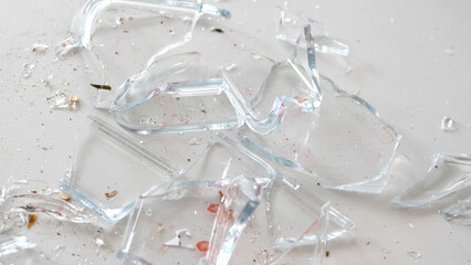 Close up of shattered glass lying on the floor - 680558382