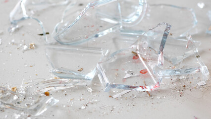 Close up of shattered glass lying on the floor - 680558391