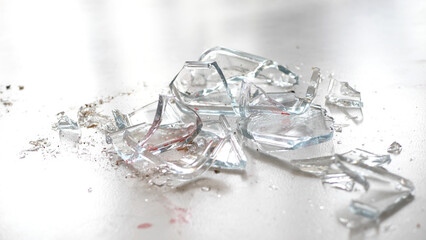 Close up of shattered glass lying on the floor - 680558394
