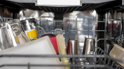 Clean dishes in a dishwasher - 680558542