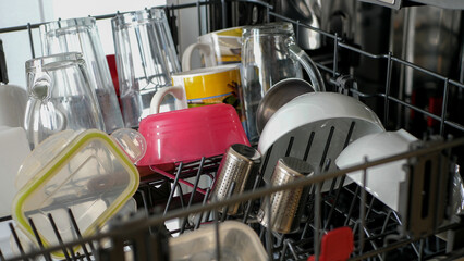 Clean dishes in a dishwasher - 680558551