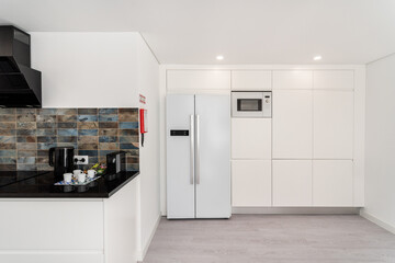 Interior background white kitchen with appliances refrigerator and counter marble free space.