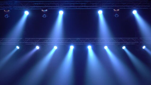 Strobe blue light from stage lighting equipment in a concert hall