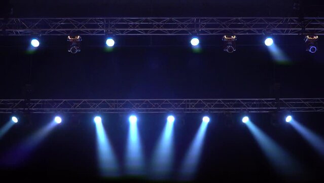 Strobe blue light from stage lighting equipment in a concert hall