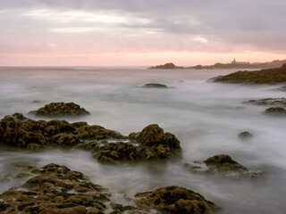Rocky sea beach at dusk