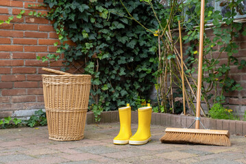 yellow boots wicker basket garden autumn bouquet broom