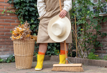 yellow boots wicker basket garden autumn bouquet broom legs apron work dry hat