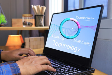 Technology concept with hand working on laptop computer to using technology to connectivity for multimedia or banking on futuristic life style