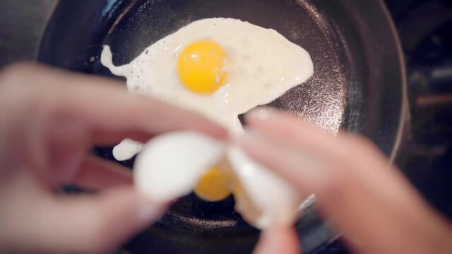 Scrambled eggs omelette . Cooking breakfast on pan