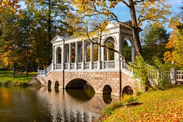 Marble bridge in autumn foliage in Catherine park, Pushkin (Tsarskoe Selo), Saint Petersburg, Russia