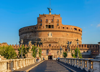 Fototapeta premium Castle and bridge of the Holy Angel at sunrise, Rome, Italy