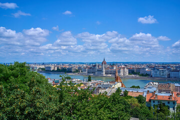 Fototapeta na wymiar Hungarian parliament building as seen from the hills on a sunny summer day. Budapest, Hungary.