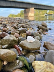 shell on stone bridge over the river 