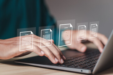 Document management concept. businessman using laptop with document icons on virtual screen, online documentation database, ERP