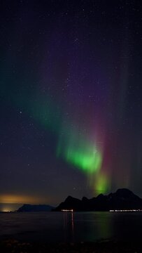 Stunningly vibrant and colorful aurora seen from Ureddplassen in Gildesk&aring;l, Northern Norway.
