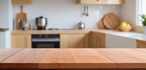 Wooden table on blurred kitchen bench background. Empty wooden table and blurred kitchen background for display or montage your products