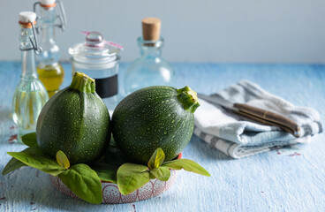 Fresh ball zucchini on a table top.
