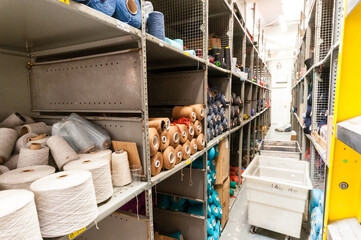 Shelves of colourful wools in a weaving factory
