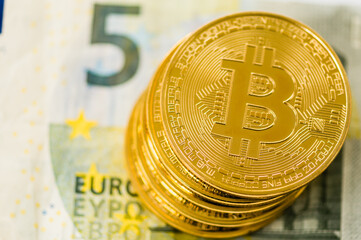 Bitcoins on a &euro;5 five Euro banknote